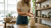 woman-spilling-soy-beads-wax